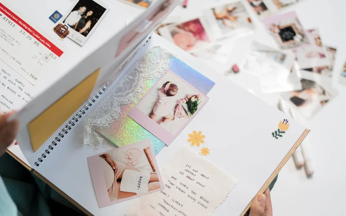 An open handmade scrapbook with photographs.