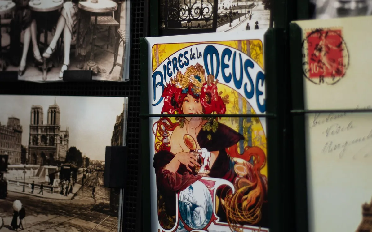 A close-up of printed Paris postcards.