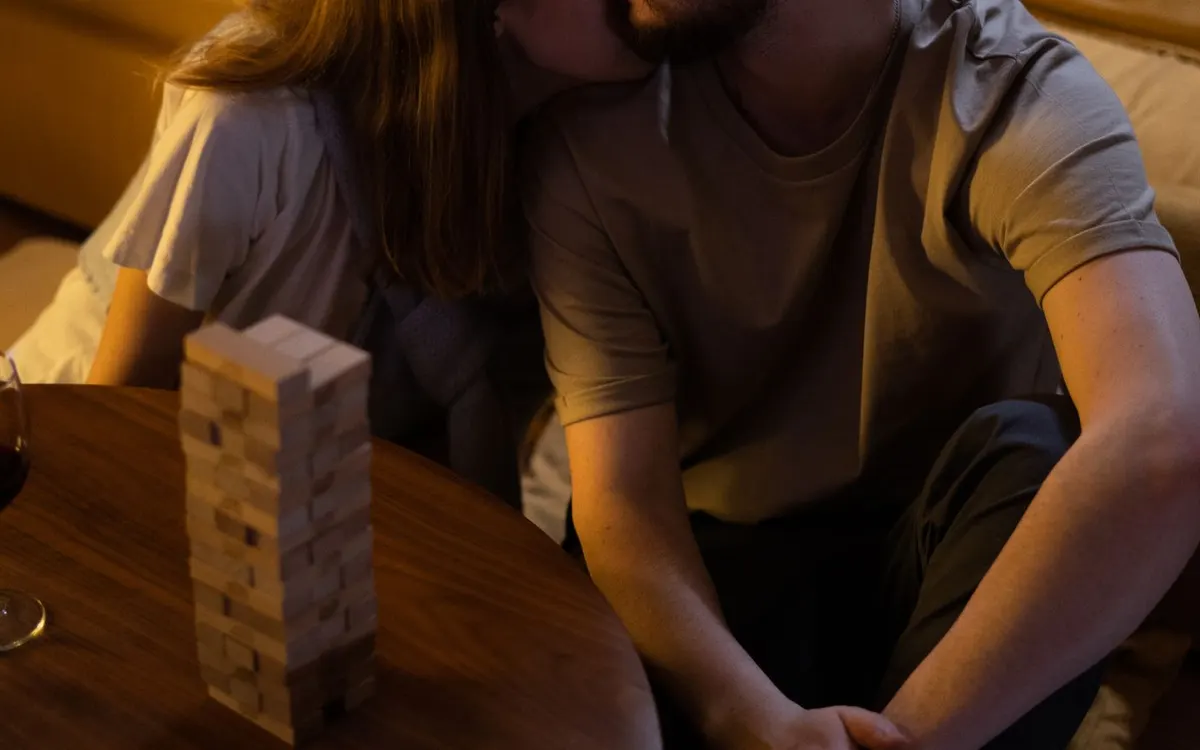 Two people sharing a game night at home.