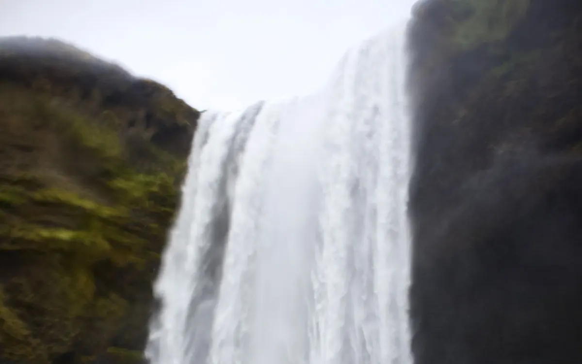 A waterfall cascading down a rocky cliff.