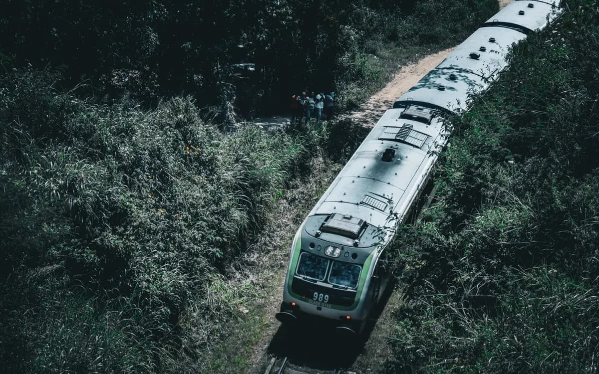 A passenger train travelling through green countryside.