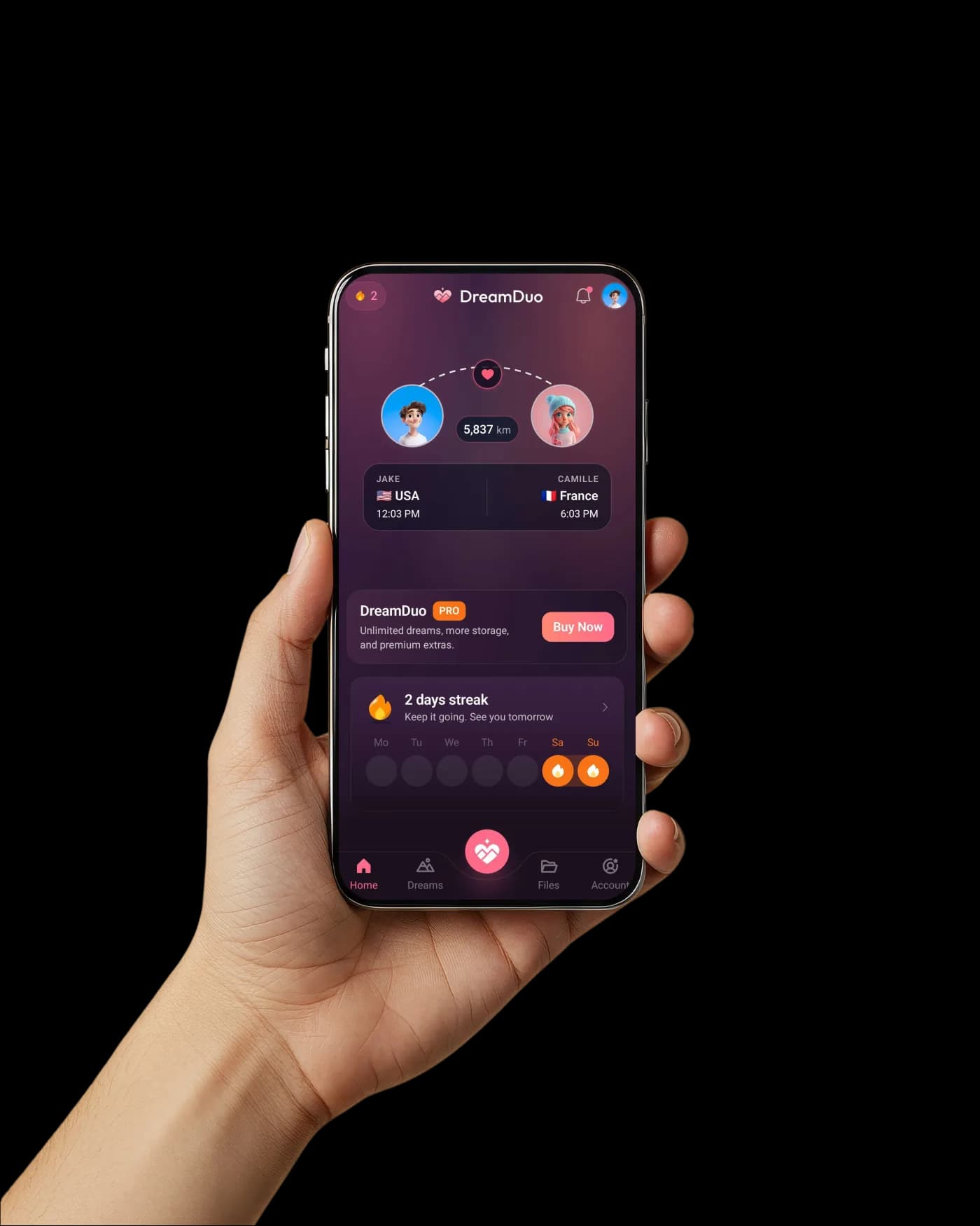 Hand holding a phone showing the DreamDuo app